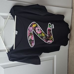 Super comfy, off the shoulder, and open shoulder/arm, lose fitting exercise top.